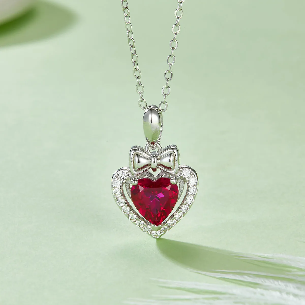 Heart-Shaped Lab Created Ruby Necklace with Halo Bow in S925 Silver Plated Platinum - 1.56 Carats